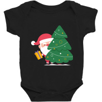 Hot Trend Santa Claus Holding A Gift Behind Christmas Tree Baby Bodysuit | Artistshot