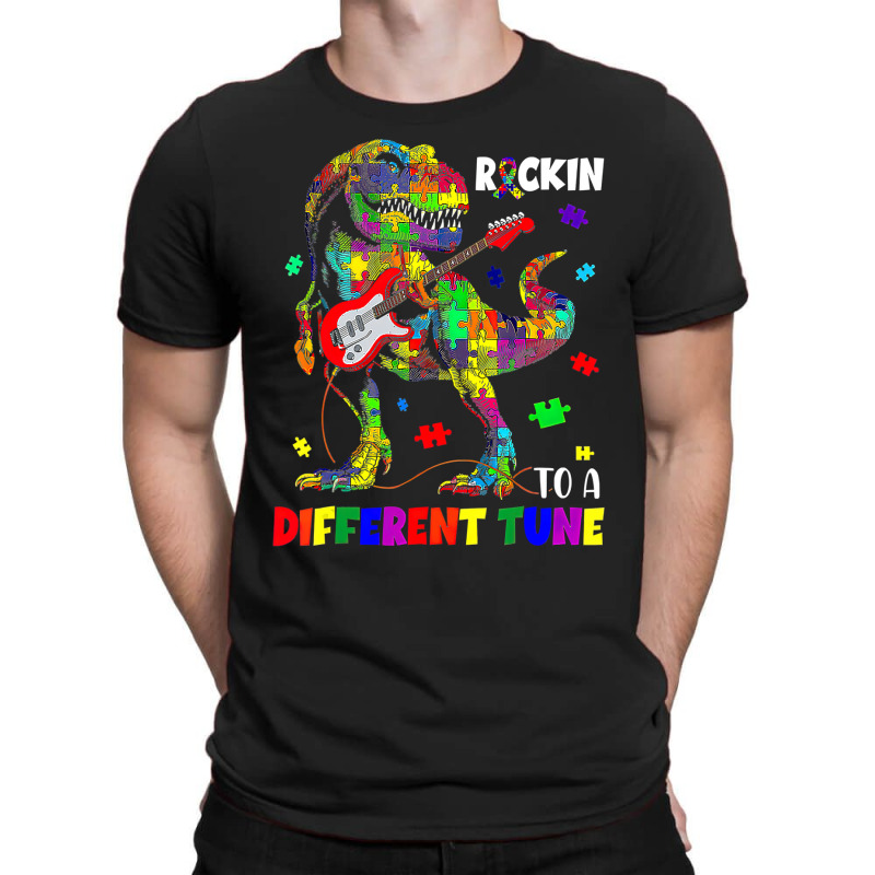 Rockin To A Different Tune Autism Awareness Trex Dinosaur T-Shirt by LeiThompson | Artistshot